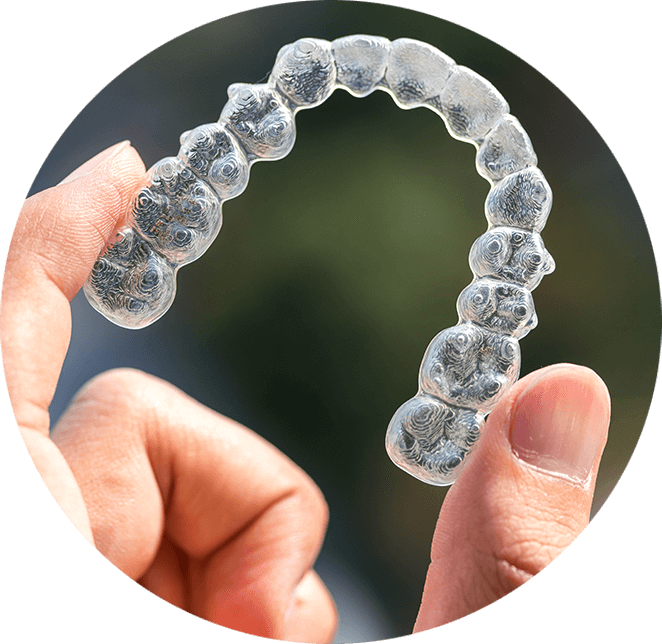 holding Invisalign in hand