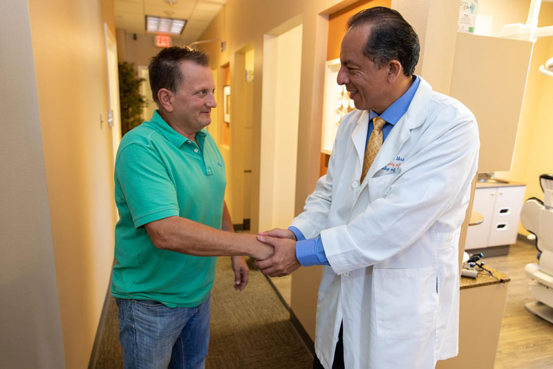 Dr Mesia Shaking Dental Patient's Hand