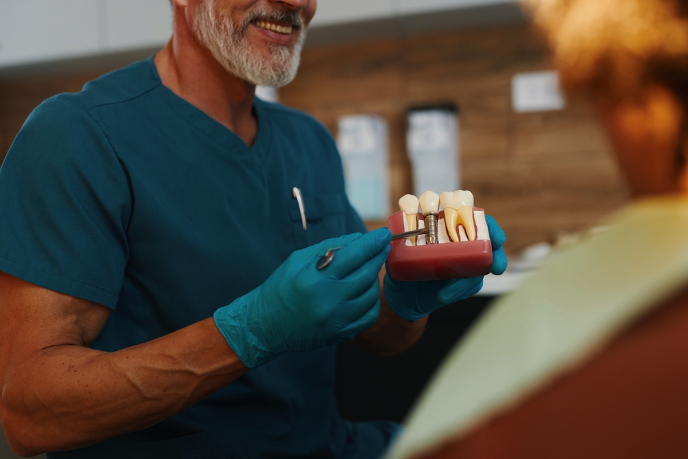 Dentist and dental props working in a dental office, dental props and dentist posing for a photo.
